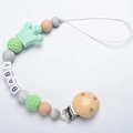 Mint green baby pacifier clip with silicone crown, marble beads, and wooden clip - Green