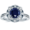 Bague fleur évidée élégante avec zircon bleu et détails argentés sur fond blanc neutre - US 7 / Bleu
