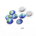 Close-up of blue-green mermaid scale resin flatback cabochons for DIY jewelry - No.11 (Blue-Green Change)