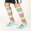 Unisex knee-high athletic socks featuring multi-color pastel stripes on a white base - SM / Light Blue