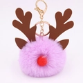 Detail of purple plush reindeer keychain with brown antlers and golden metal ring - Taro Purple