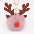 Detail of pink faux fur pompom keychain with reindeer antlers and golden clasp - Dust Rose