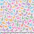 Macro view of 4x7mm white acrylic beads with colorful Russian Cyrillic letters for DIY - White with Colorful Russian Letters