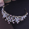 Macro detail of baroque tiara featuring pink and blue crystals with rhinestone leaf patterns - Handmade / Antique Bronze Pink Rhinestone