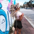 Pink lace lace-up back top paired with black fringe denim shorts in a trendy summer set - S / Black