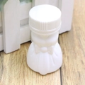 Macro shot of white heart-shaped bubble wand bottle with decorative plastic bow detail - Wedding Dress Style
