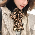 Faux rabbit fur collar with leopard print ribbon bow tie styled on a winter wool coat - Black + Coffee Leopard