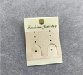 Close-up of beige paper jewelry display card with golden Fashion Jewelry text on felt - Beige Sticker