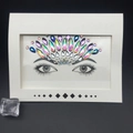 Face crystal stickers in iridescent AB and blue shades arranged on white card - Style 1032