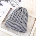 Detailed close-up of grey cable knit texture on thick mohair winter beanie hat for women - One Size / Fleece Lined Gray