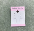 Detail view of pink and white cardboard jewelry display card with Fashion Jewelry text - Pink Sticker