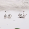 Pair of minimalist matte silver cat-shaped stud earrings for women with simple style - Left-Right Miss Cat