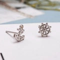 Asymmetric 925 silver stud earrings featuring nautical anchor and ship wheel designs - Anchor