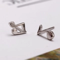 Shiny silver music note stud earrings with asymmetrical eighth and quarter note design - Music Note
