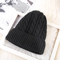 Detail of black mohair knit beanie featuring classic cable stitch texture and folded cuff - One Size / Fleece Lined Black