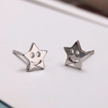 Star-shaped smiley face stud earrings in polished silver finish for women minimalist style - Smiling Star
