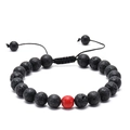 Close-up of black lava stone beads with a red accent on an adjustable woven bracelet - Black Lava Stone with Single Red Decorative Bead (Size 11)
