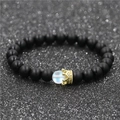 Close-up of beaded crown bracelet with matte black beads and iridescent moonstone accent - Black Stone Single (NBCB00010A)