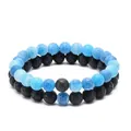 Detailed macro view of 8mm black lava stone and blue cracked agate beaded bracelets - Blue Crackle Beaded Bracelet And Black Lava Stone Bracelet Set