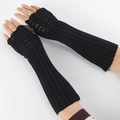 Detail of black knitted fingerless gloves with thumb hole and ribbed cuffs for warmth - One Size / Black