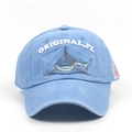 Detail of embroidered shark and letters on a vintage washed blue cotton baseball cap - Adjustable / Blue