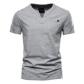 Detail of grey cotton blend Henley shirt showing the chest pocket and premium texture - Gray