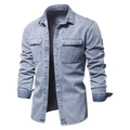 Detail of light blue washed denim shirt featuring dual chest pockets and metal snap buttons - S / Blue