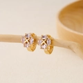 Macro view of gold huggie earrings with cross-arranged oval zircons on a wooden branch - Marquise Zirconia Cross Flower(EH410015)