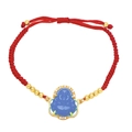 Detailed macro view of the blue Buddha charm and red woven cord on this Chinese-style bracelet - Blue