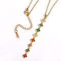 Golden stainless steel necklace featuring colorful zircon clover charms on a white background - Gold