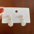 Silver needle flower pearl earrings featuring white rose design on display card - White Pearl Flower