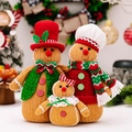 Three-piece knitted gingerbread man family figurines with festive hats and scarves - Gingerbread Man Family of Three Ornaments Set