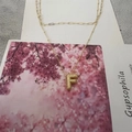 Golden letter F pendant necklace with pavé crystal accents and stylish mixed chain - Letter F