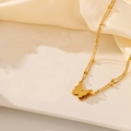 Gold stainless steel double-layered butterfly necklace with small bead accents - Gold Necklace (I202)