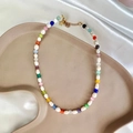 Detailed view of baroque pearl necklace with colorful beads and gold star charm - Gold Star Pendant / Pearl Colorful Cat's Eye 38+5cm