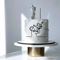 Minimalist black acrylic cake topper featuring a parent lifting a child, 8.7cm height - Father Lifting Child / Black