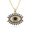 Detailed macro shot of a golden evil eye pendant with blue and white micro-pave crystals - Oval Evil Eye Style (F179)