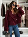 Detail of burgundy wool short coat featuring double-breasted tortoise buttons and lapel collar - S / Tops / Burgundy