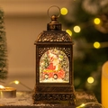 Bronze vintage Christmas lantern featuring a Santa Claus sleigh scene and swirling glitter - Santa in Car