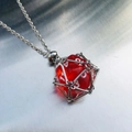 Silver cage necklace featuring a translucent red D20 dice pendant on a chain - Silver Cage with Bright Red Dice