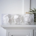 Detailed view of white glitter flower ornaments in a transparent box for holiday decor - Stamen Style / Small