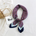 Vintage red silk scarf with blue geometric floral patterns tied on a white shirt - Checkered Flowers Navy Edge