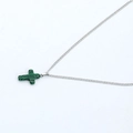 Green malachite cross pendant necklace with a polished silver-tone chain on white background - Green