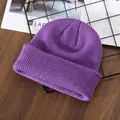 Solid purple knit beanie for men and women, warm winter skullcap for casual outdoor wear - Purple