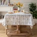 Linen rectangular tablecloth with gray scroll patterns on cream background in dining room - Pteris Flower Grey