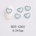 Macro shot of silver heart nail art charm with blue crystals and 520 engraving - 520 Number Heart Style(A364)