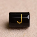 Black cylindrical bead with gold glitter letter J for DIY jewelry making and crafts - Letter J
