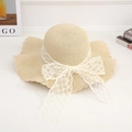 Beige wide brim straw sun hat with white lace bow and elegant wavy edge detail - Lace Diamond Beige