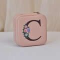 Pink portable PU leather jewelry box featuring a floral letter C and zipper closure - Print C