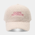 Macro view of teddy fleece baseball cap with pink God's Favorite embroidery detail - Adjustable / Beige